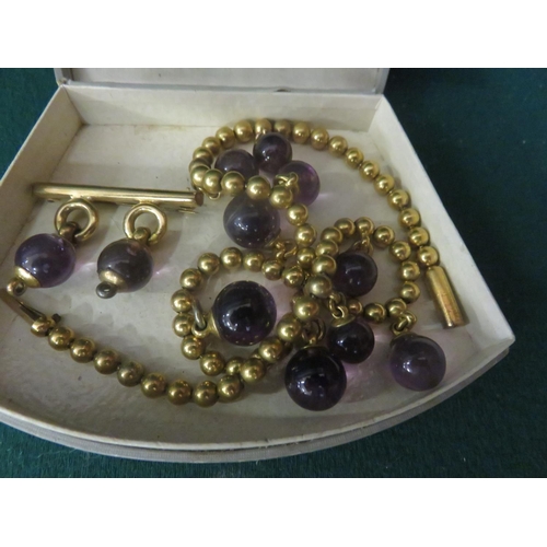 84 - Gilt Metal and Amethyst Style Ball Necklace and matching 9ct. Gold Brooch