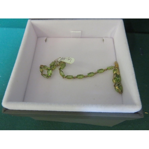 69 - 9ct Gold and Peridot Bracelet