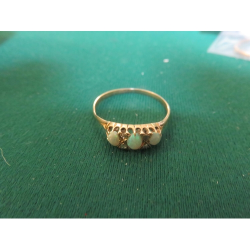 77 - 18ct gold, opal and diamond chip ring