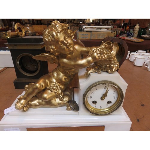 199 - Marble effect and gilt cherub figure mantel clock