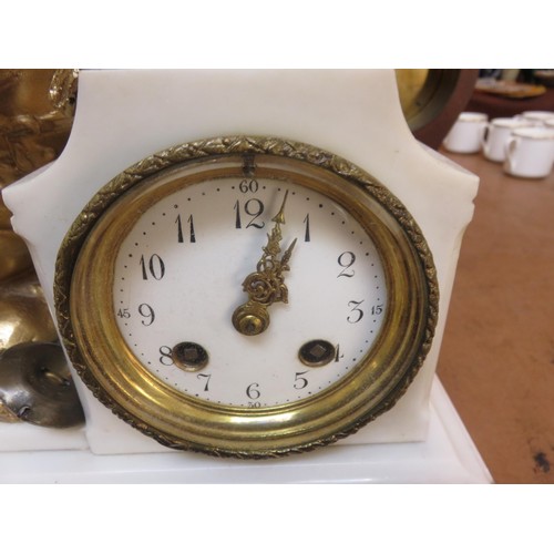 199 - Marble effect and gilt cherub figure mantel clock