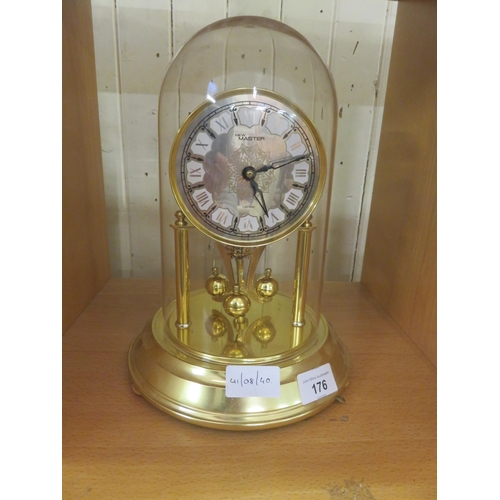 176 - Brass Clock in Plastic Dome