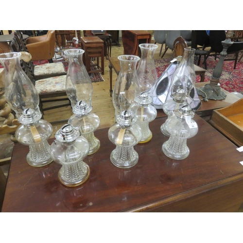 66 - Seven Glass Oil Lamps