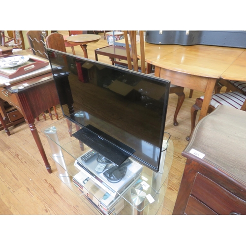 422 - Panasonic TV, stand, DVD Player, quantity of Records