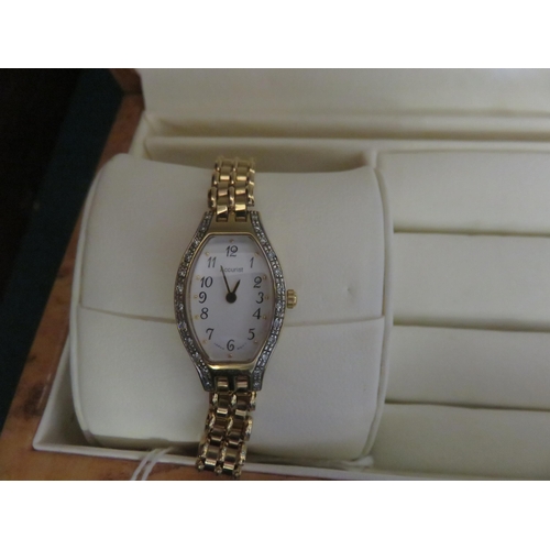 58 - 9ct Gold and Diamond Set Accurist Ladies Wristwatch
