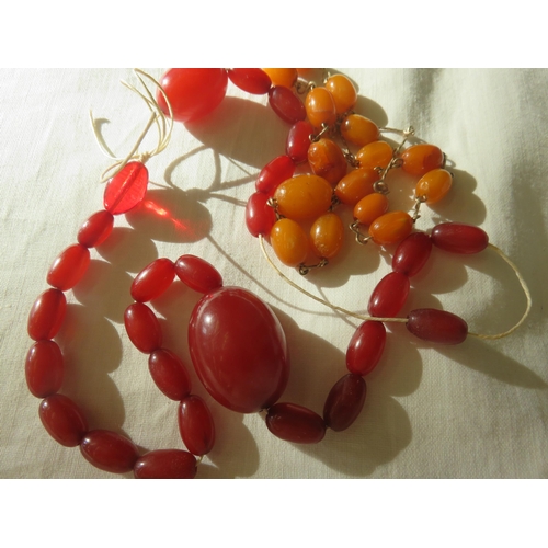 63 - Two Strings of Amber Style Beads