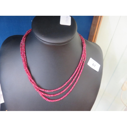 61 - 3 Strand Ruby Necklace with 18ct. Gold Clasp