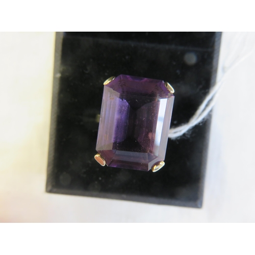 107 - 9ct. Gold Purple Stone Ring