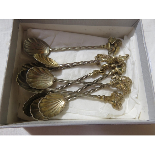 115 - Eight Scallop Shell Salt Spoons with Twisted Stems and a Variety of Exotic Finials