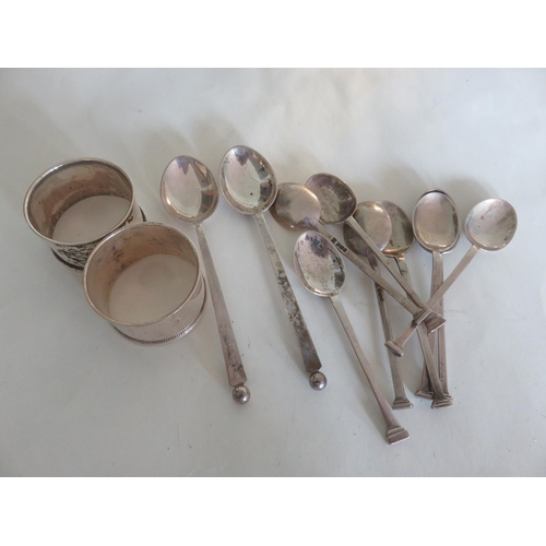 110 - Ten Silver Teaspoons and Two Silver Napkin Rings