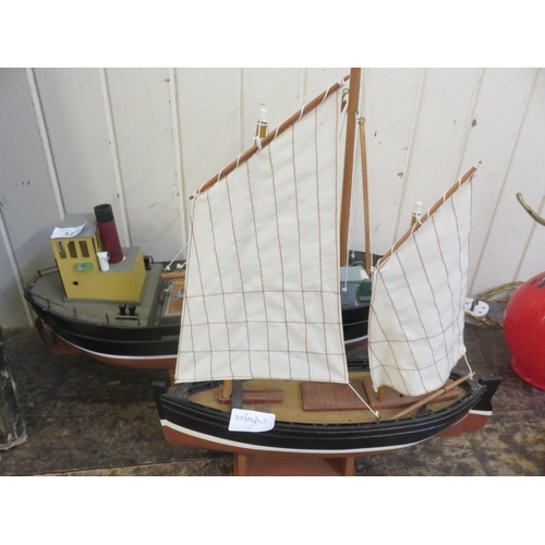 327 - Two Model Boats on stand