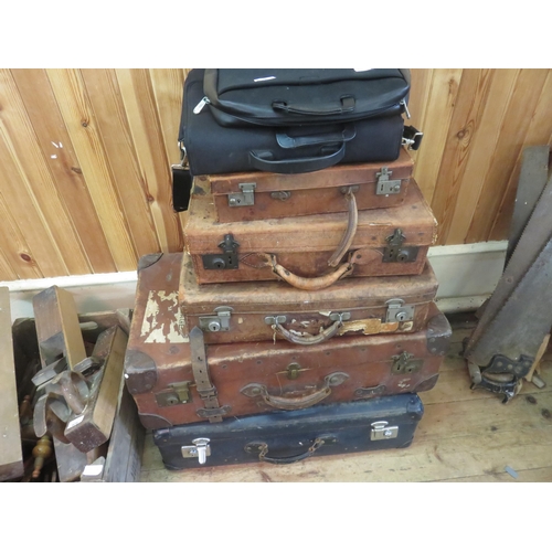 425 - Five various suitcases and two bags