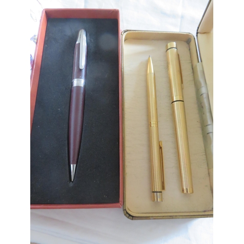 100 - Two Gold Plated Pens plus One Other