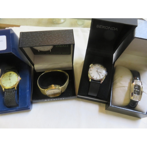 111 - Four boxed Watches