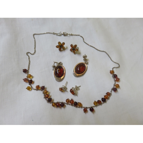 74 - Silver and Amber Necklace and three pairs of Amber Earrings