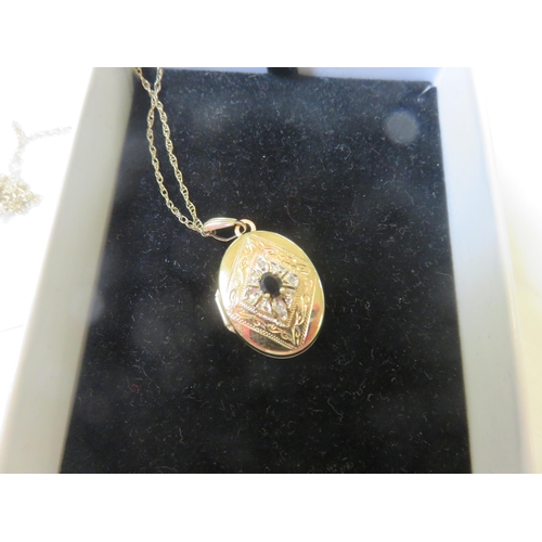 77 - 9ct. Gold Locket on Chain set with Sapphire and Diamonds