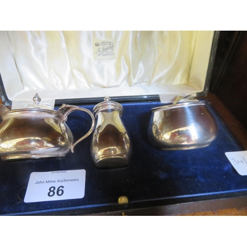 86 - Cased Birmingham Silver three piece Cruet set