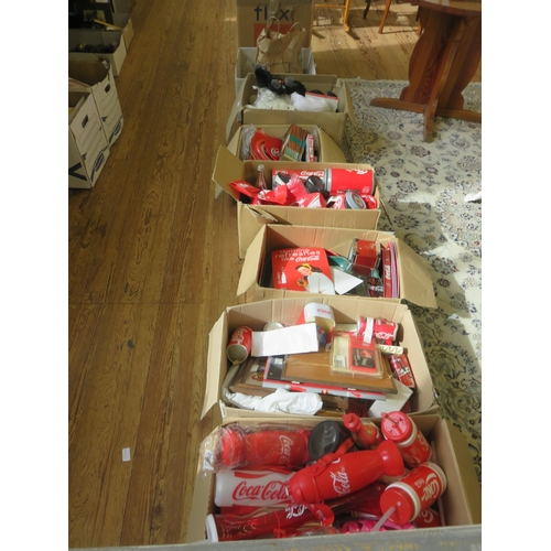 472 - Six Boxes of Coca Cola Memorabilia including Teddies, Water Bottles, Pencil Cases, etc