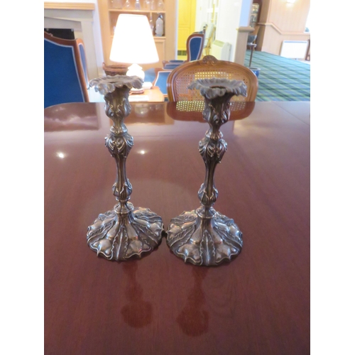 93 - Pair of Plated Candlesticks on circle bases, 11 ins. tall