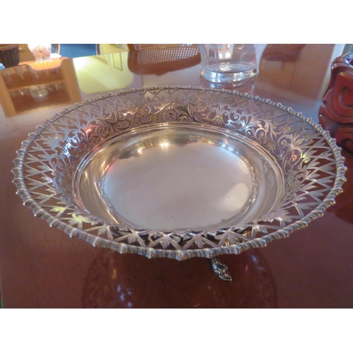 95 - Pierced Rimmed London Silver Dish on three feet, 19½ troy ozs.