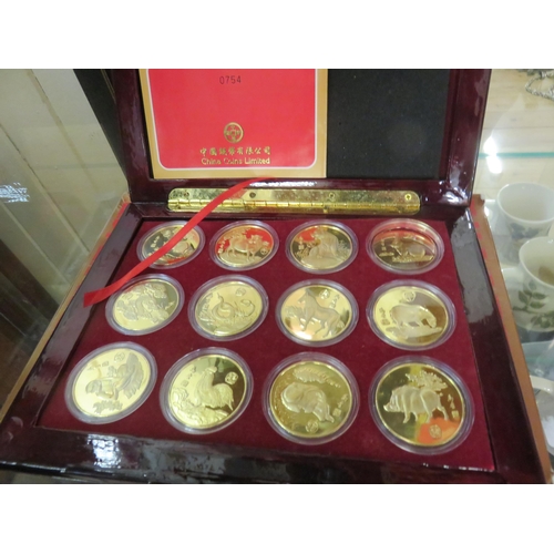 191 - Lacquered Case Containing A Set of 12 Chinese Coins