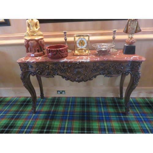 193 - Heavily Carved Shaped front and marble topped console table, 57 ins. wideStarting Bid 60 GBP