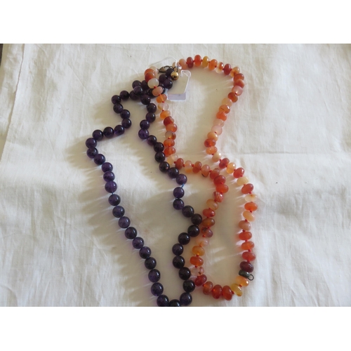 108 - Two Strings of Amethyst and Amber Style Beads