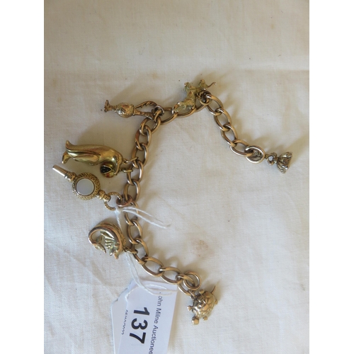 137 - 9ct. Gold Charm Bracelet, 34.1 grams