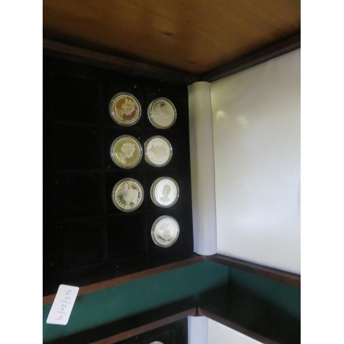 65 - Case Containing Seven Queen Mother Silver Coins