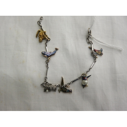 131A - Bracelet with six gold and platinum charms