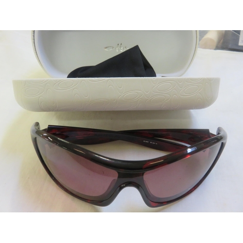 302 - Cased Ladies Oakley Sunglasses