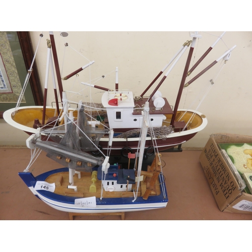 145 - Two Wooden Model Fishing Boats on stands, one with working lights