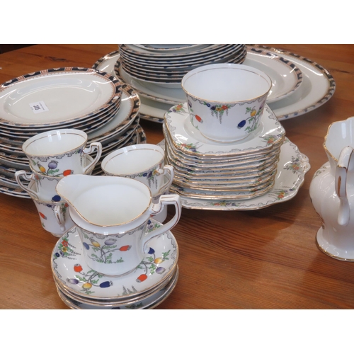 385 - Three sets of mixed tea and dinnerware with lamps and shades.