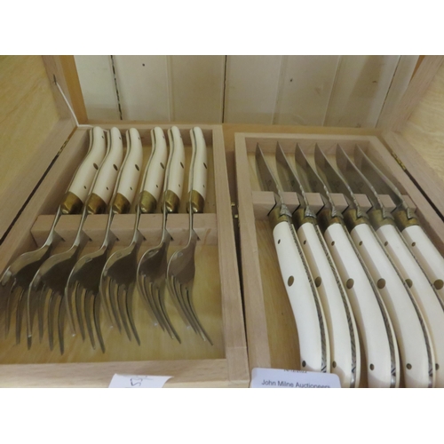 187 - Two wooden cases of French Cutlery