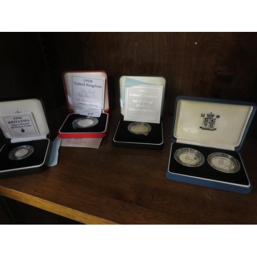 77 - Four various Cased Silver Collectors' Coins