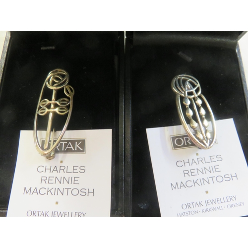 112 - Two Boxed Ortak Charles Rennie MacKintosh style Brooches