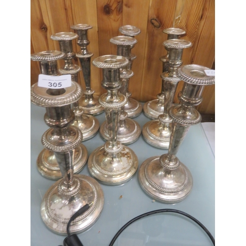 305 - Five pairs of Plated Candlesticks