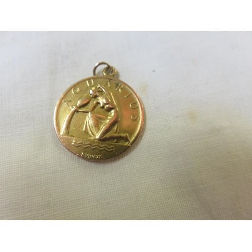 78 - 9ct. Gold Aquarius Medallion