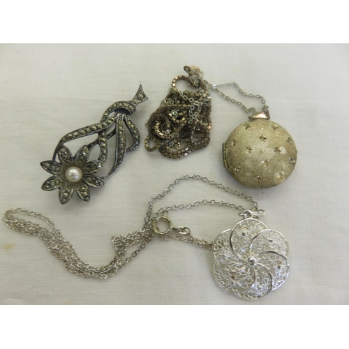 124 - Two Silver Pendants on Chains and one Silver Brooch