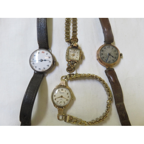 106 - Two 9ct gold cased watches, two others