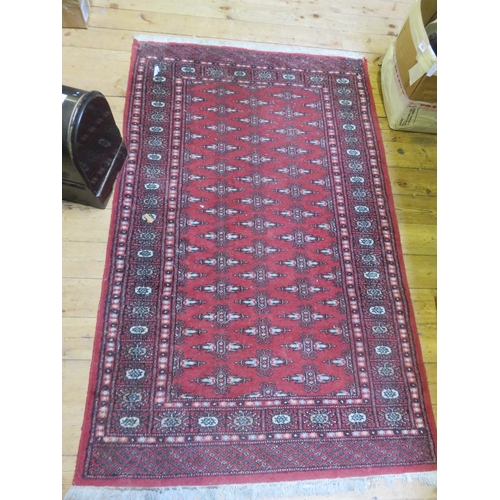 308 - Fringed Rug on Red Ground