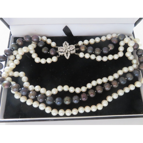 103 - 3 Strand Cultured Pearl Necklace with 14ct. Gold Diamond Clasp