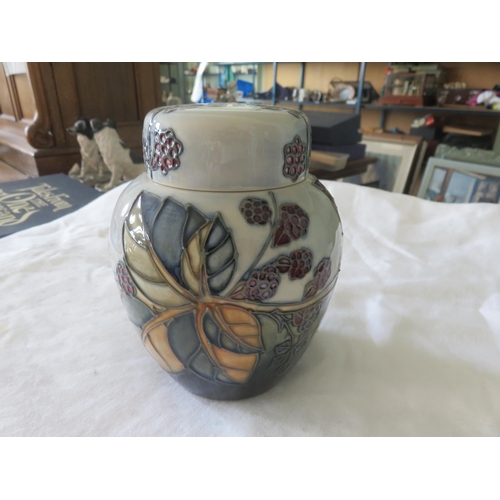 73 - Boxed Moorcroft Jar with lid