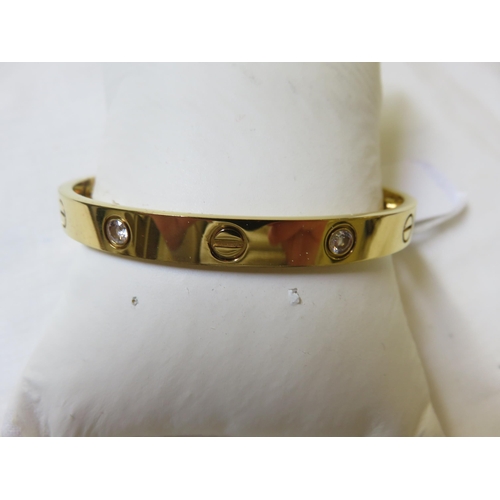 92 - Yellow Metal and White Stone Bangle