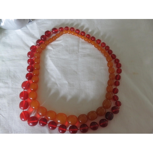 102 - Two Cherry and Honey Amber Type Necklaces