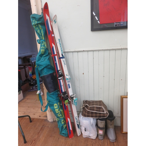 424 - Two Pair of Ski Boots, Three Pairs of Skis