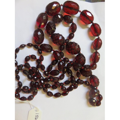 153A - Two Strings of Cherry Amber Type Beads