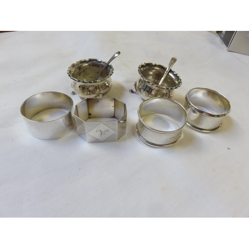 104 - Four odd Silver Napkin Rings and Cruets