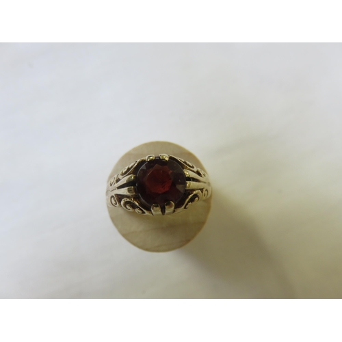 81 - 9ct. Gold and Garnet Ring, size 0