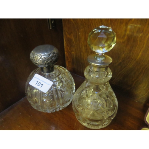 101 - Two Silver cut-glass perfume bottles